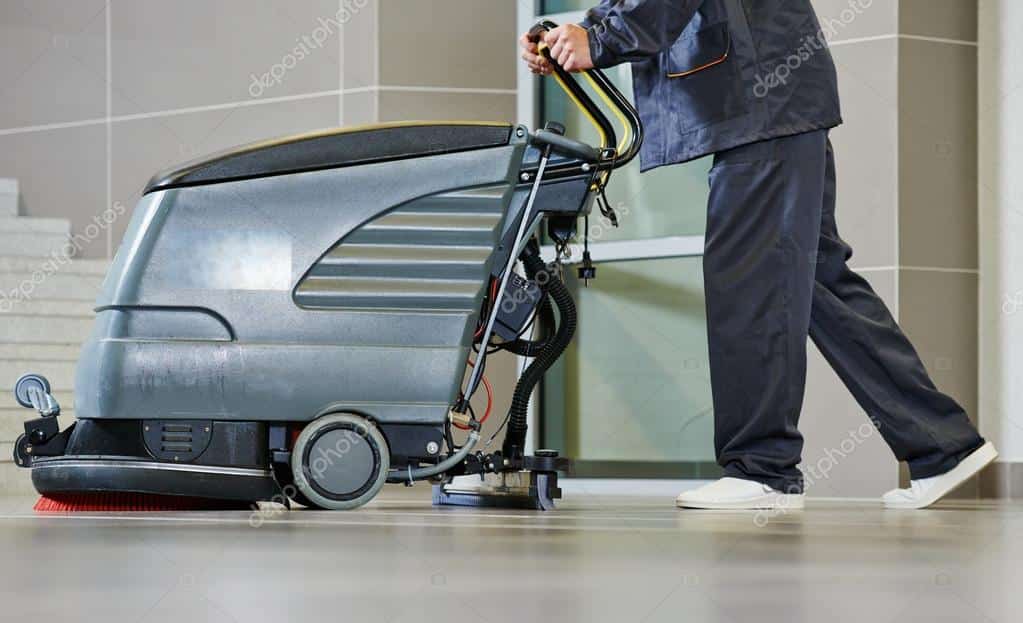 depositphotos 52491363 stock photo worker cleaning floor with machine Copie